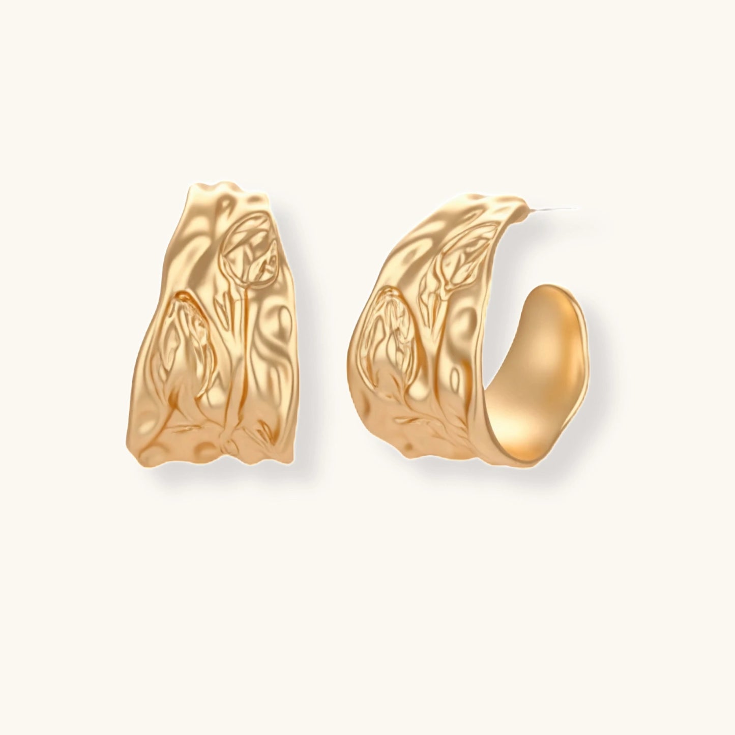 Close-up of textured hoop earrings with liquid metal ripple pattern in eco-zinc alloy with sterling silver posts.